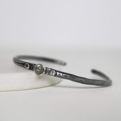 Natural labradorite cabochon set in textured sterling silver