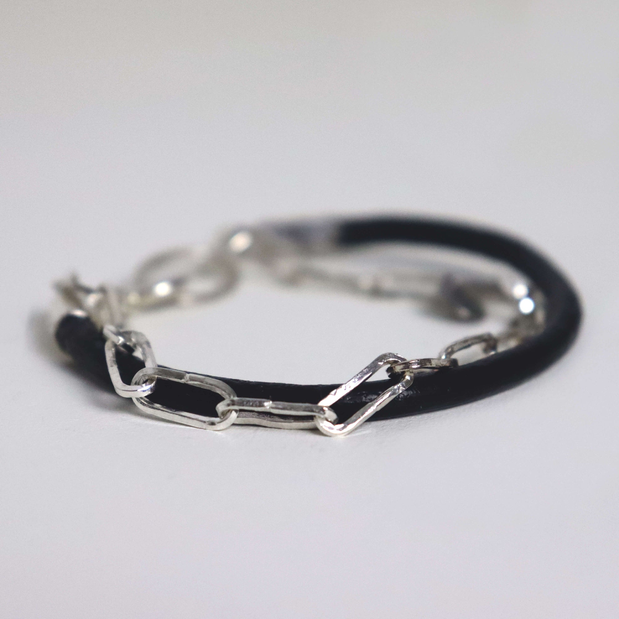 sterling silver link chain and leather bracelet with textured finish