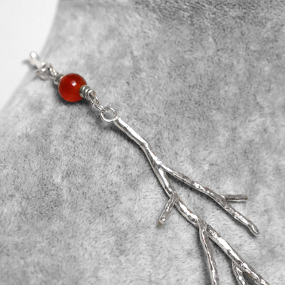 artistic necklace with hand filed coral shaped silver link, hammered silver, red carnelian beads, by small business roff jewellery