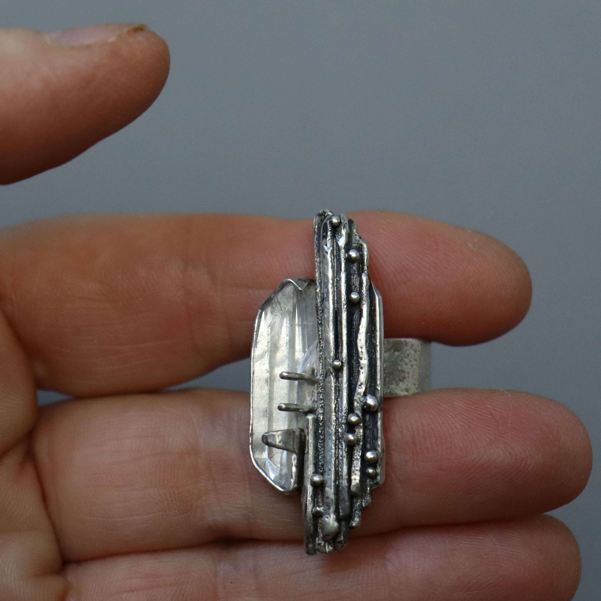 silver ring,oxidized texture, granules, quartz crystal, 7mm wide adjustable band, handmade by roff