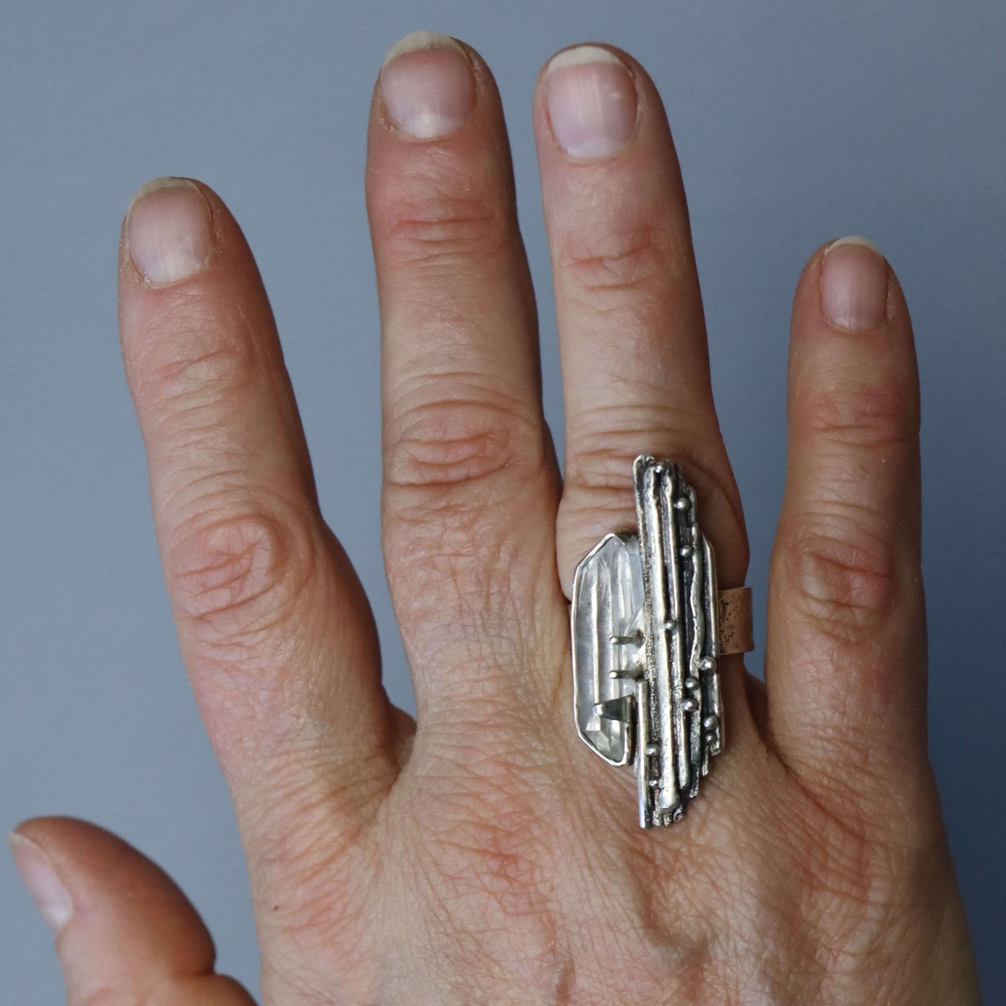 organic silver ring with natural uncut clear quartz, adjustable in size, made by hand roff jewellery