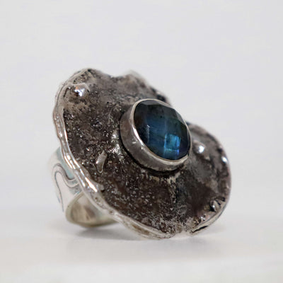 Handmade silver ring with oxidised finish, wave pattern on adjustable ring band, unique design by Roff Jewellery