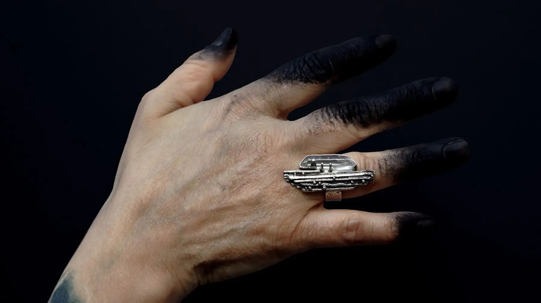 Brutalist silver ring set with raw crystal