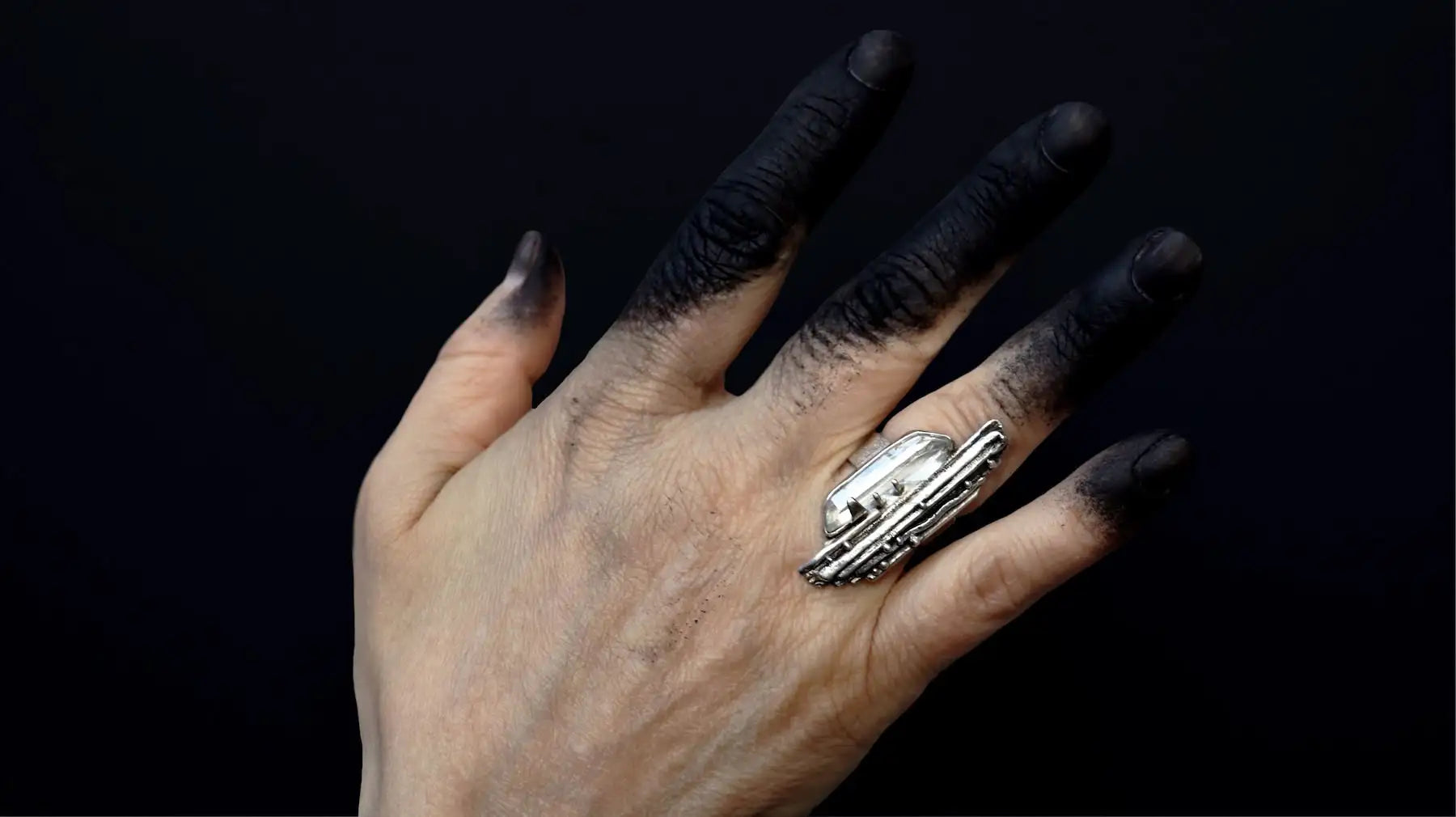 Brutalist silver ring set with raw crystal