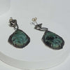 oxidized silver drop earrings with rough crystals. contemporary emerald earrings, handmade by roff
