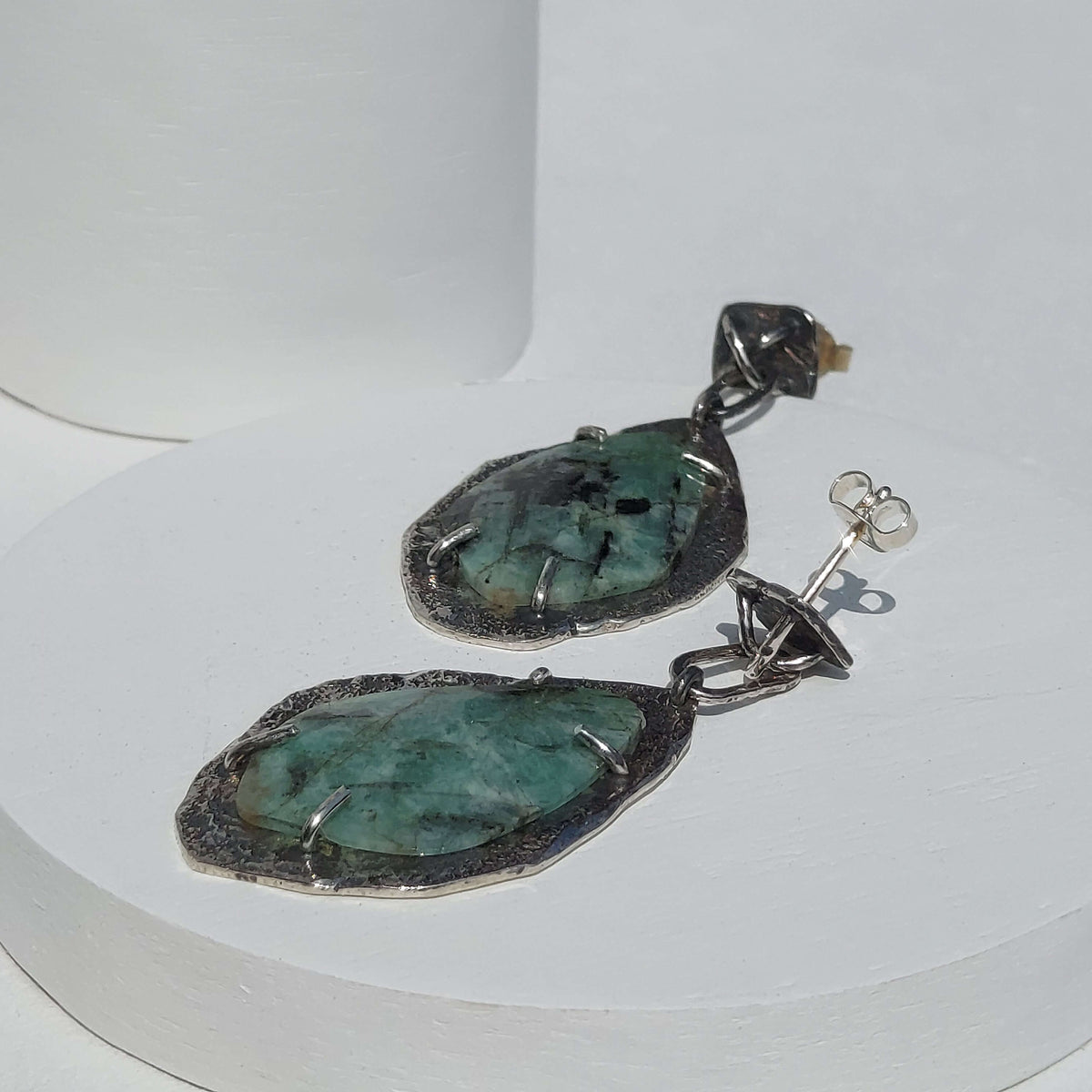 edgy silver earrings, textured silver earrings with raw emerald, handmade earrings by roff jewellery