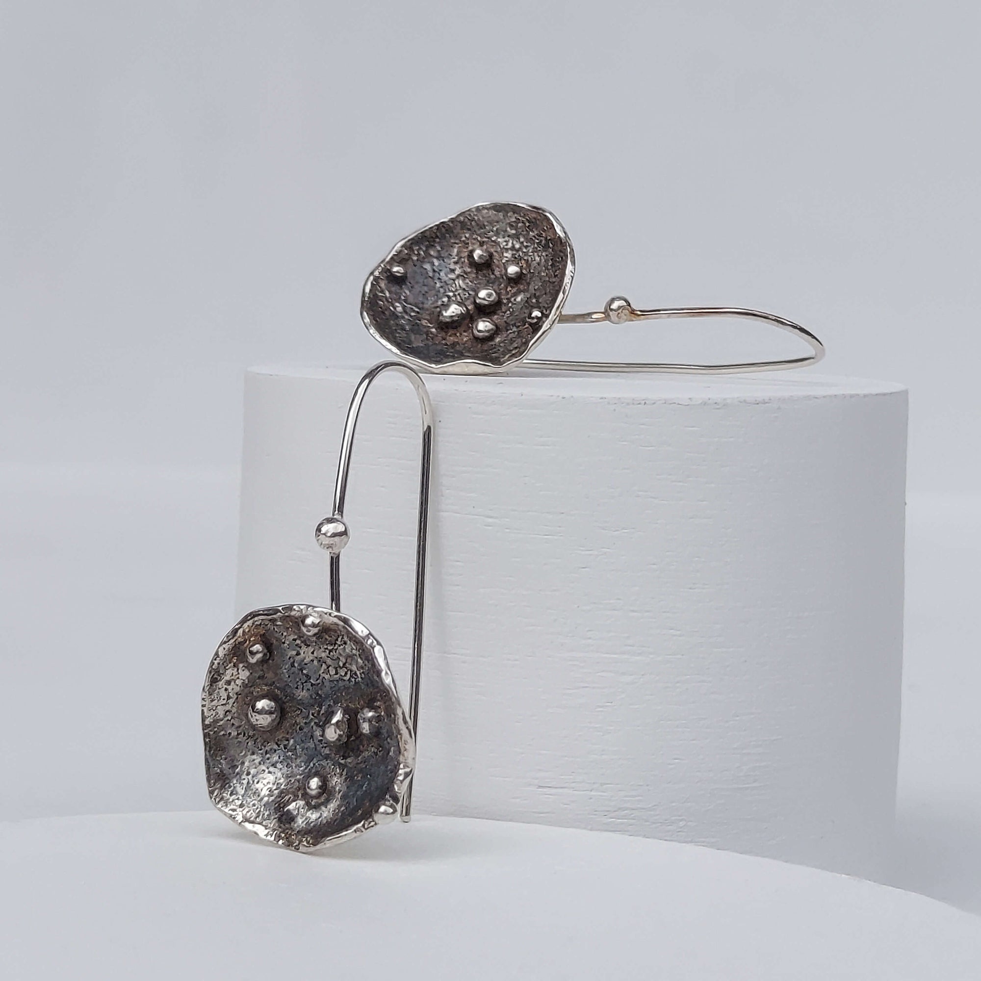 bench made silver earrings, modern design, silver drop earrings in shiny and black silver, by roff