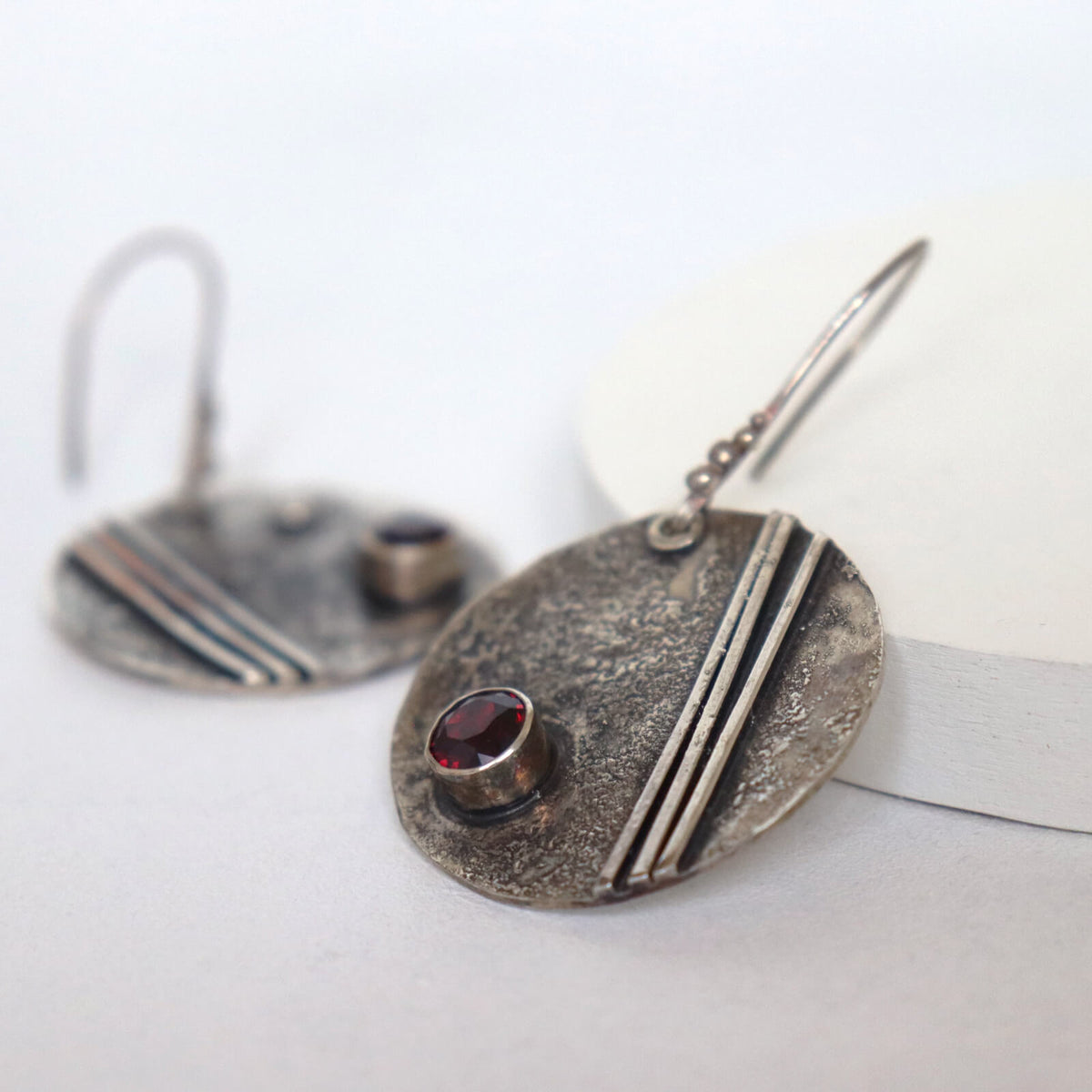 oxidized silver earrings with stripes and garnet stones, large dangle earrings, handmade by roff
