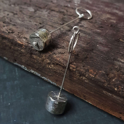 Handmade silver cylinder shaped dangle earrings, rough pattern and texture, by roff jewellery