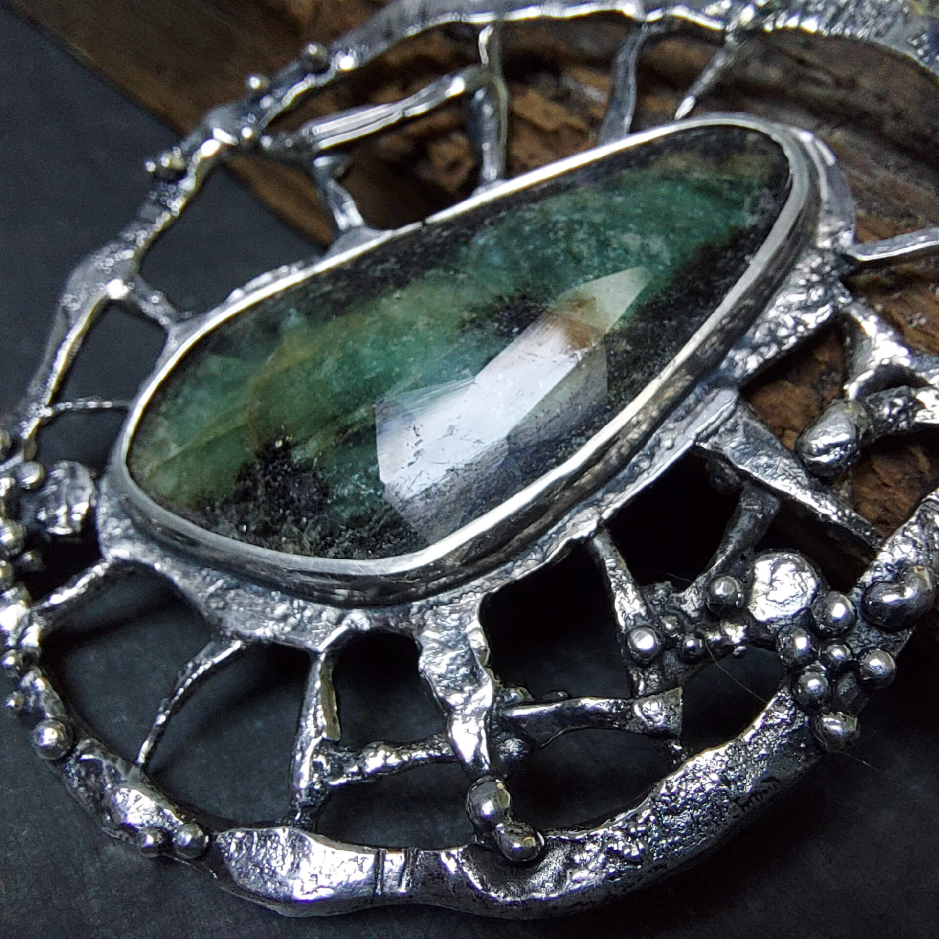rough silver pendant, round silver wheel with granules ,green black emerald, handmade by roff