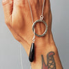 Oxidized hammered silver necklace with round pendant with slip through onyx bead, handmade by roff