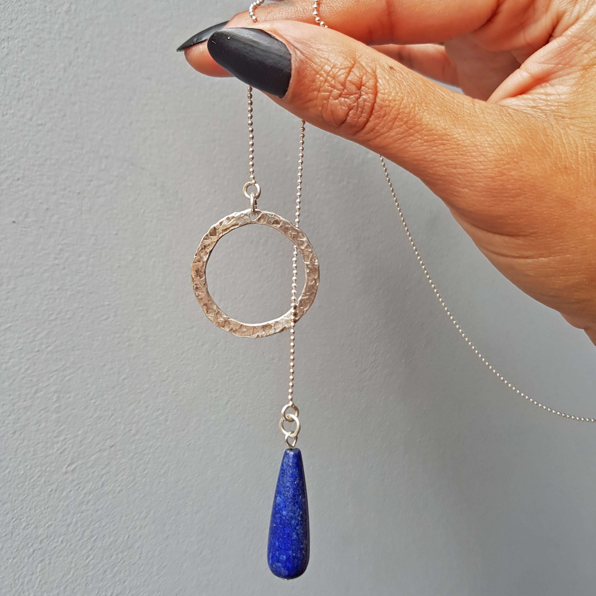 primitive minimalist hand made necklace with oxidized and hammered silver round pendant by roff