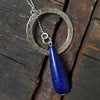 hand hammered silver circle necklace with lapis lazuli bead on a silver ball chain,by roff jewellery
