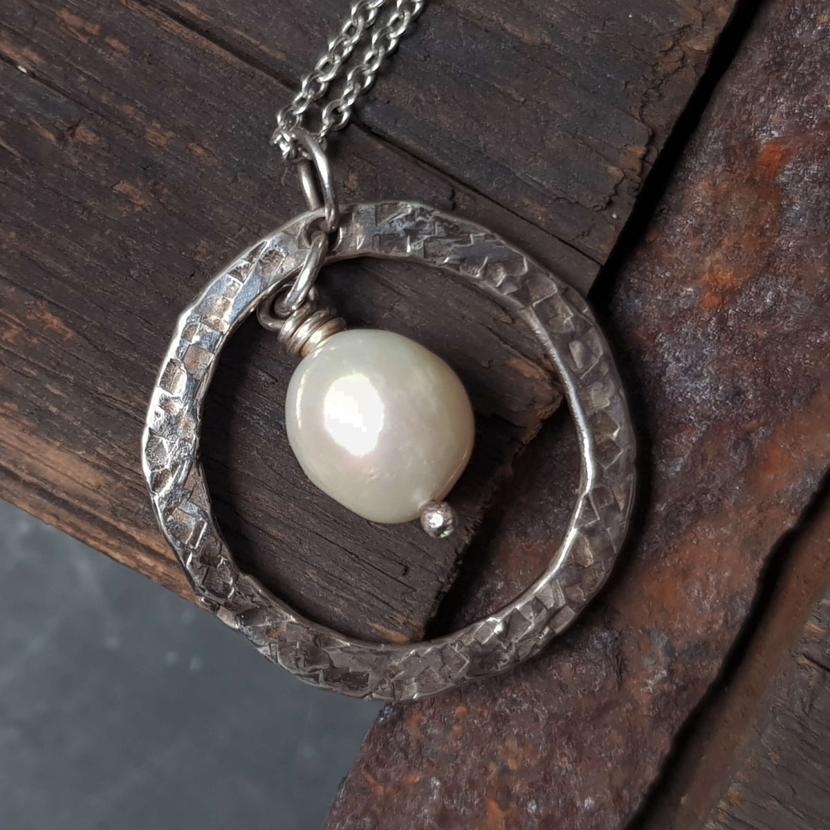 round hammered silver pendant with white pearl on fine silver necklace,handcrafted by roff jewellery