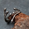 Oxidized silver wire ring with molten drop ends. open in the front, handmade to order by roff