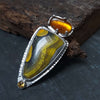amber with insect ring with bumblebee jasper and topaz. Handcrafted ring by roff jewellery