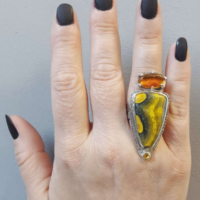 artisan made statement ring with amber with fossil, a bumblebee jasper & yellow topaz, by roff