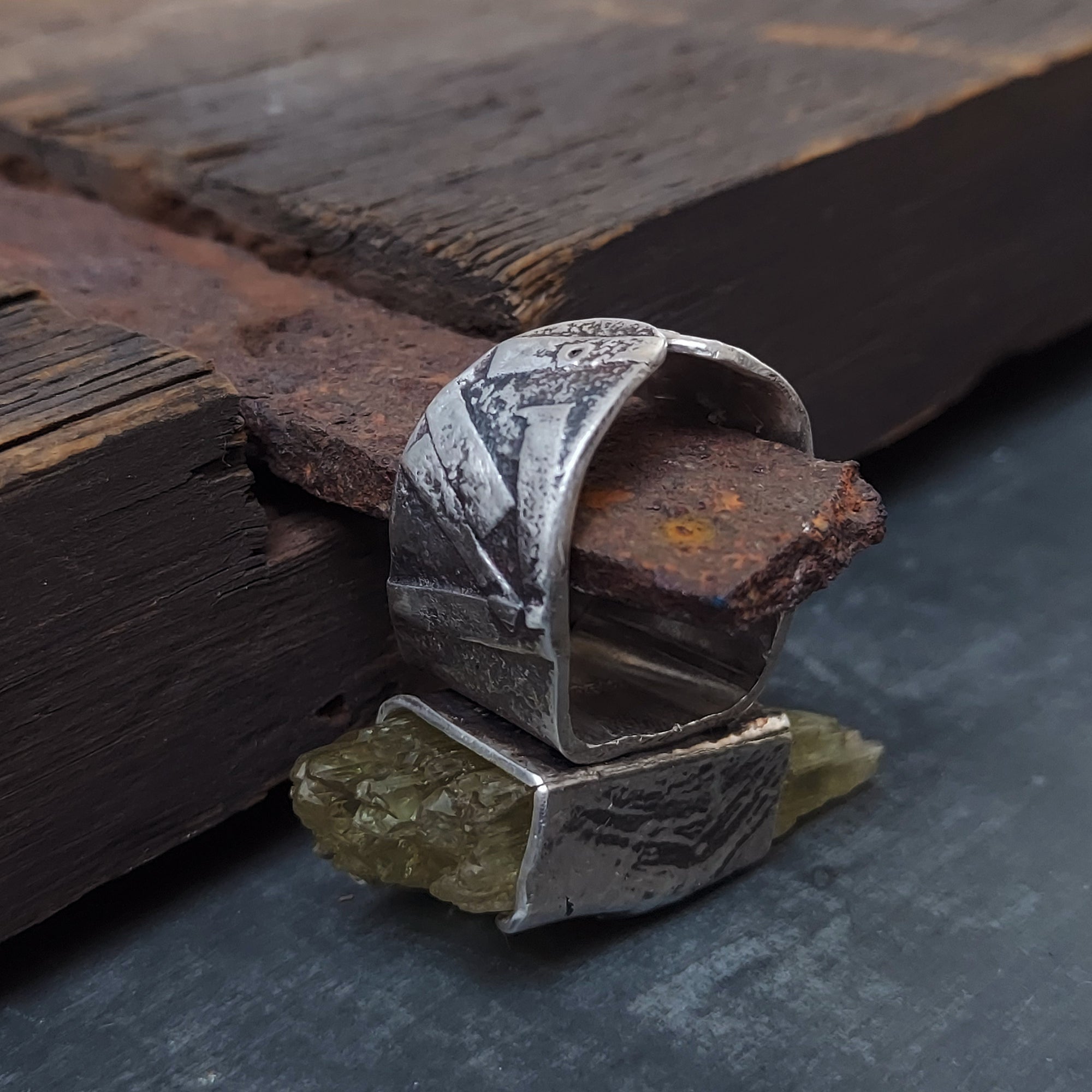 geometric pattern on an adjustable ring , rough hiddenite gemstone, handcrafted by roff jewellery