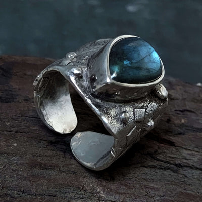 Rough texture, oxidized silver ring,blue labradorite stone in the middle.Handmade by roff jewellery