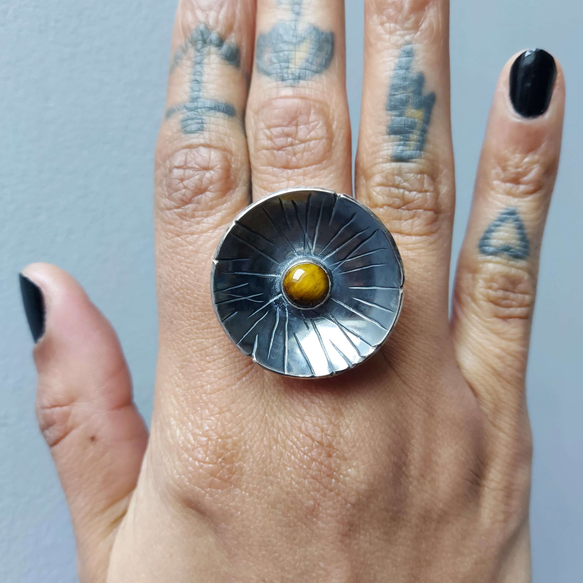 tigereye stone set in a black silver bowl,rough lines texture, oxidized silver, handmade by roff