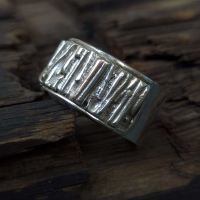 modern silver signet ring with silver and copper accents, artistic and unique, handmade by roff