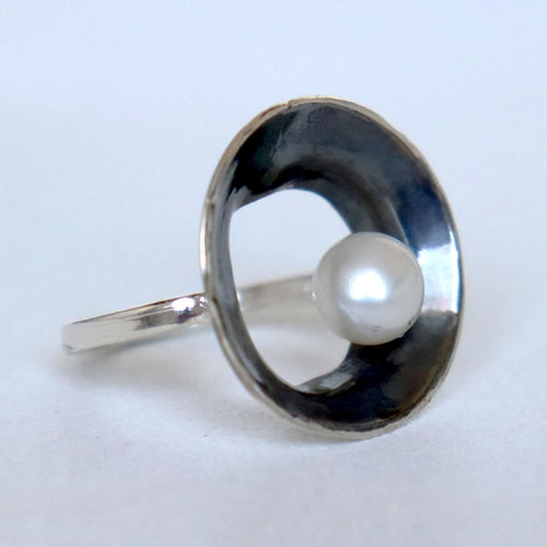   round open silver ring black silver and white pearl. handmade by roff jewellery