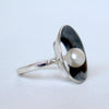 Handcrafted silver ring with dark patina and white pearl. small ring for women by roff jewellery