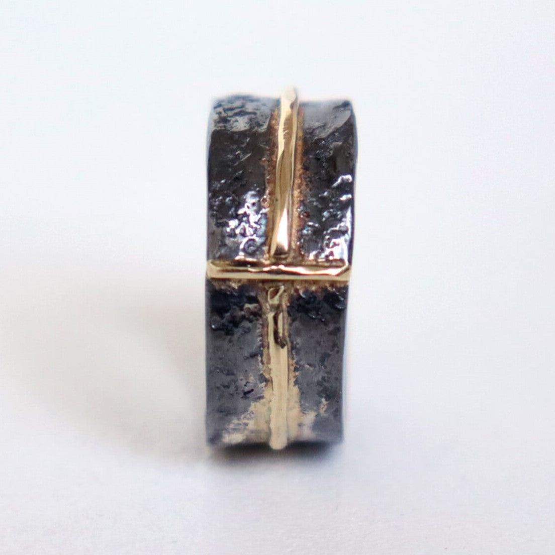 textured silver ring with gold accents, handmade ring by roff jewellery. made to order in any size