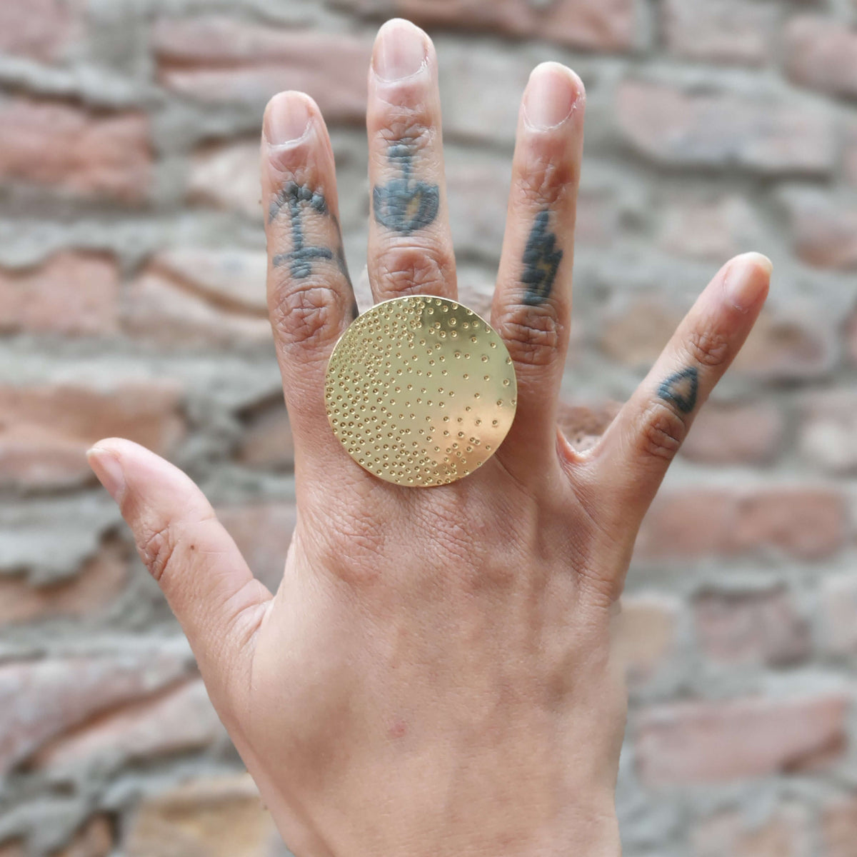 modern xl brass ring, copper disc with tiny hammered dots. Adjustable ring, made by roff jewellery