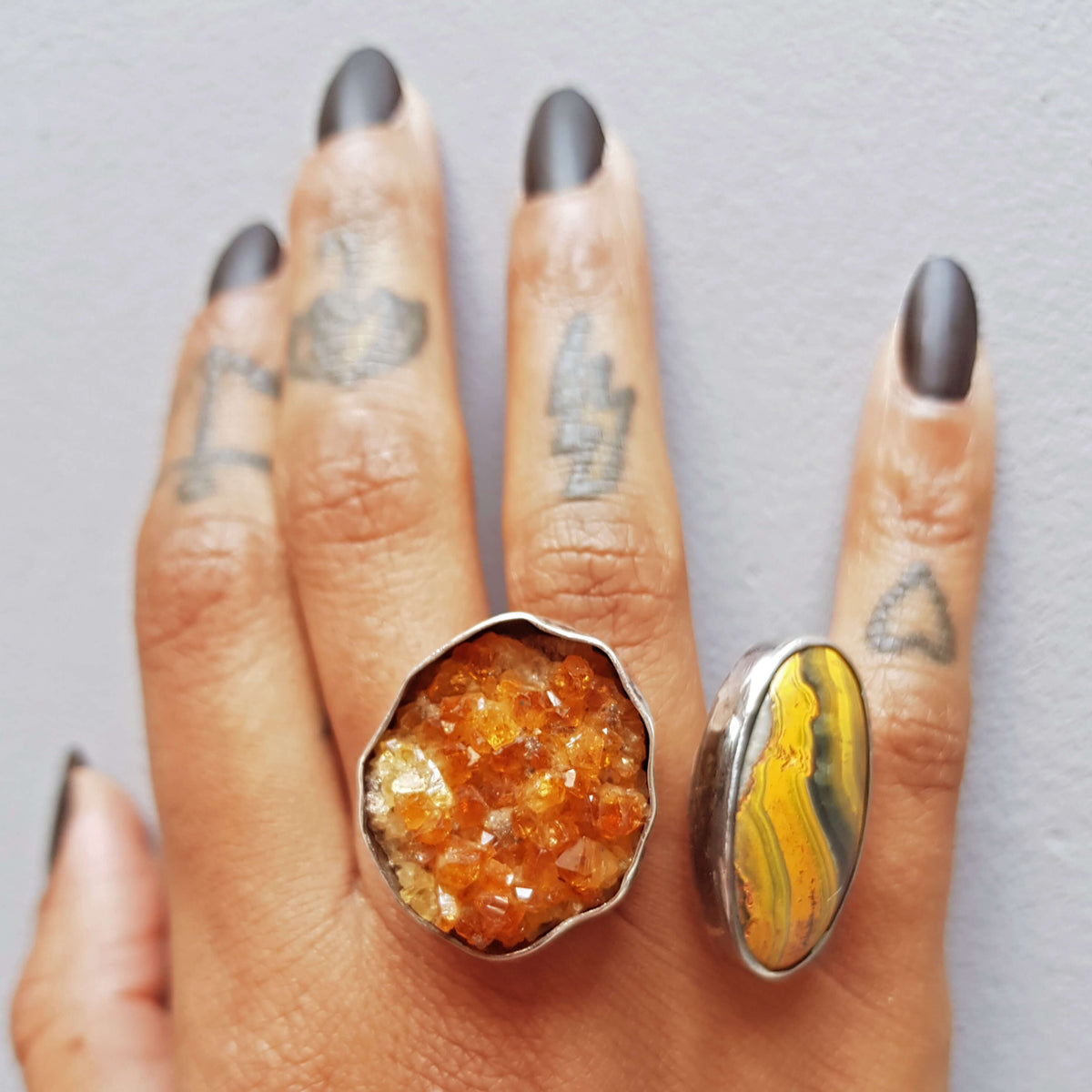 knuckleduster ring with bumblebee jasper and raw citrine stone. handmade ring by roff jewellery