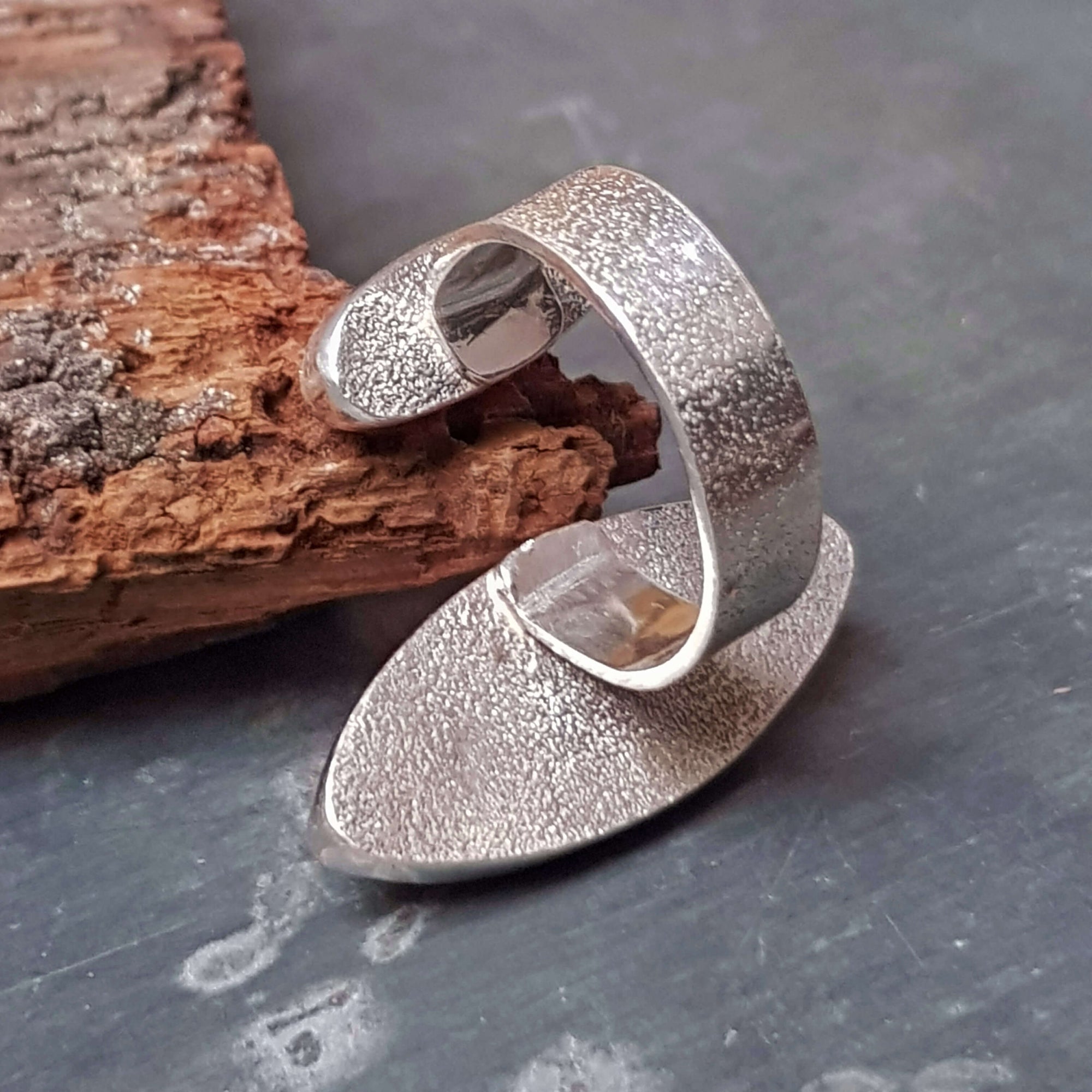 fine pattern silver ring, polished on the inside, open front, adjustable ring handmade by roff