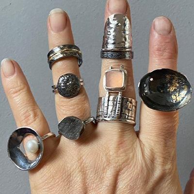 collection of textured silver rings, oxidized silver and gold rings, handmade by roff