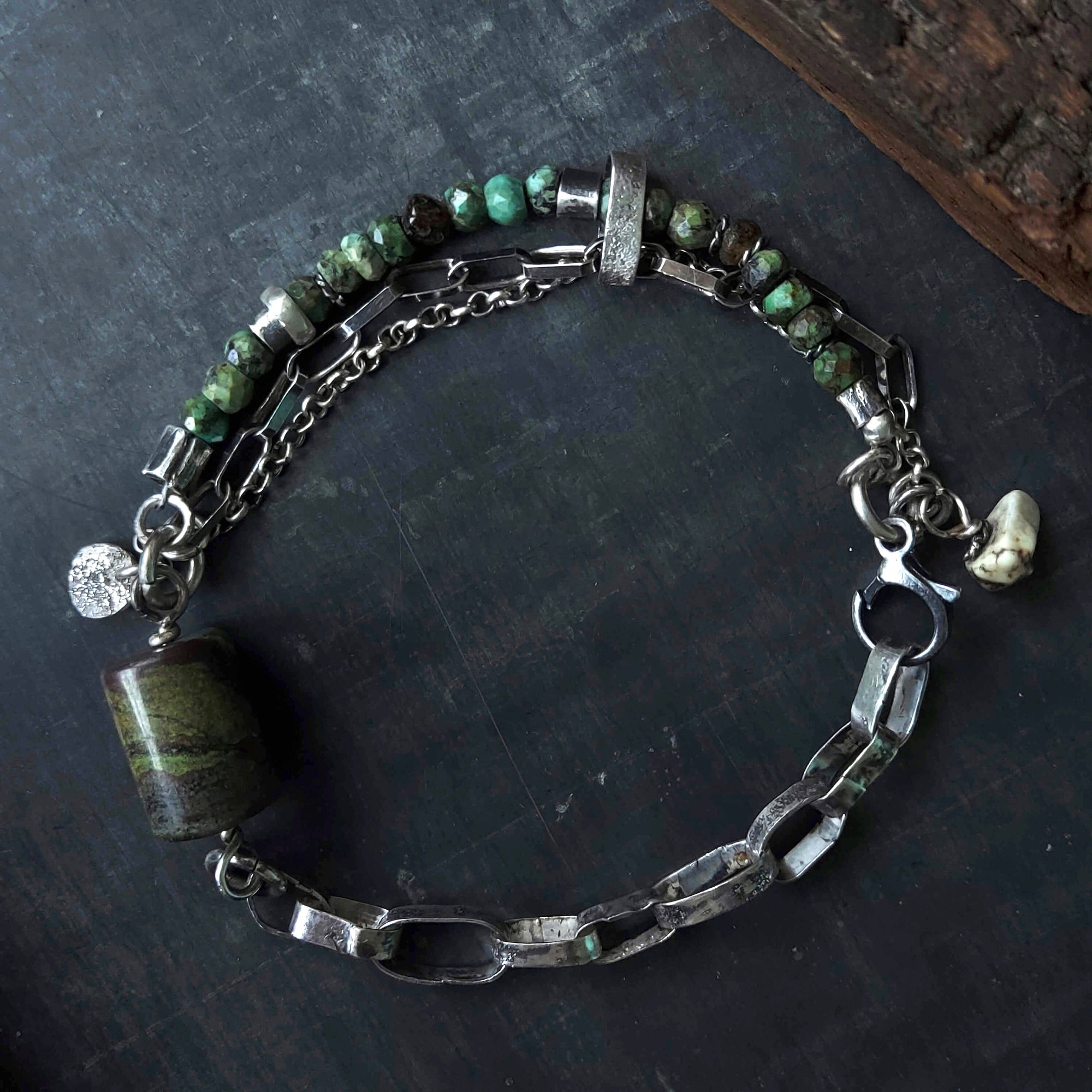 Turquoise bead bracelet with hammered and oxidised silver links, turqois beads, silver charms, closes with a round silver lobster clasp