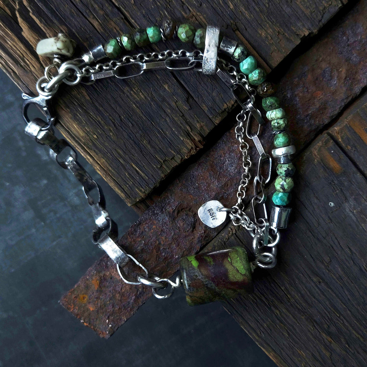 oxidised silver bracelet with white pebble charm, silver chains, handmade silver bracelet with turquoise gemstone beads, silver beads and raw amber beads, suitable for men and women